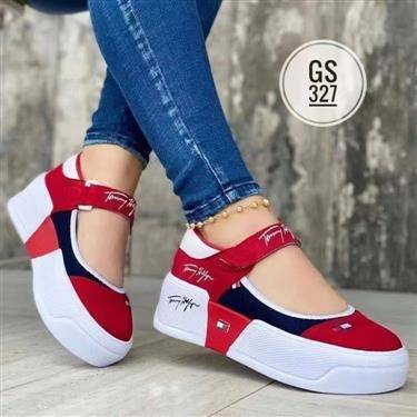 Female fitted with sneakers with buckle