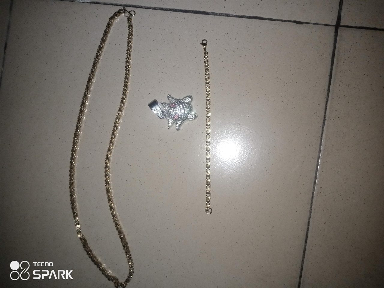 Gold hand chain and neck chain