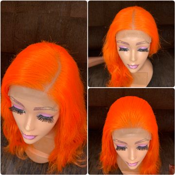 Bright orange wavy or curly C-cut wig
