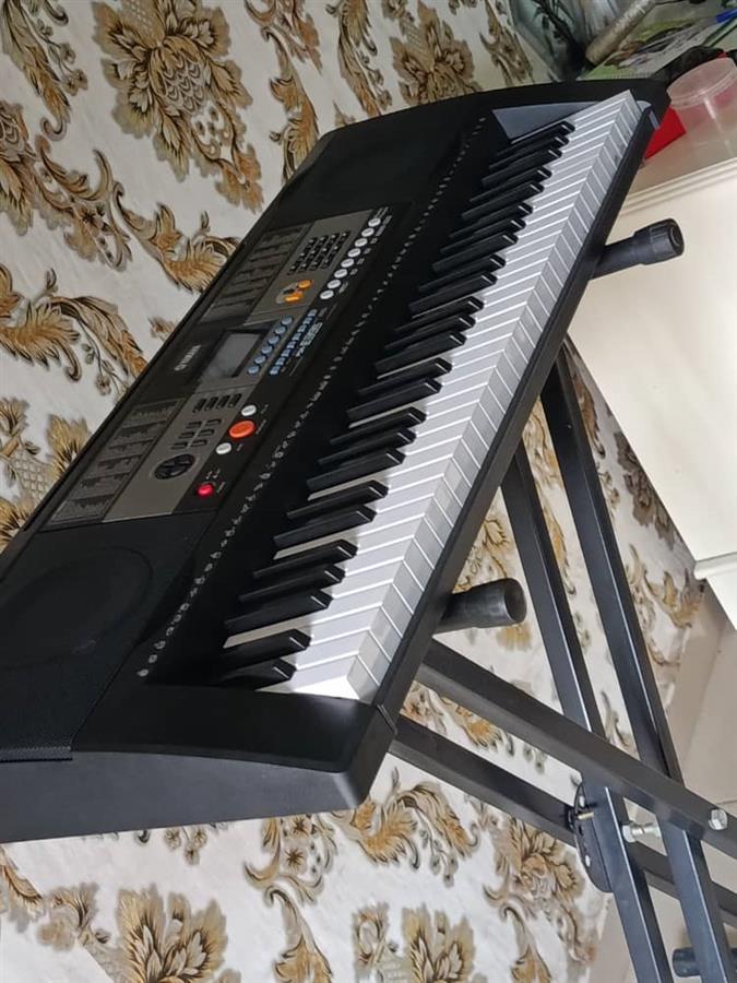 Yamaha keyboard piano with stand